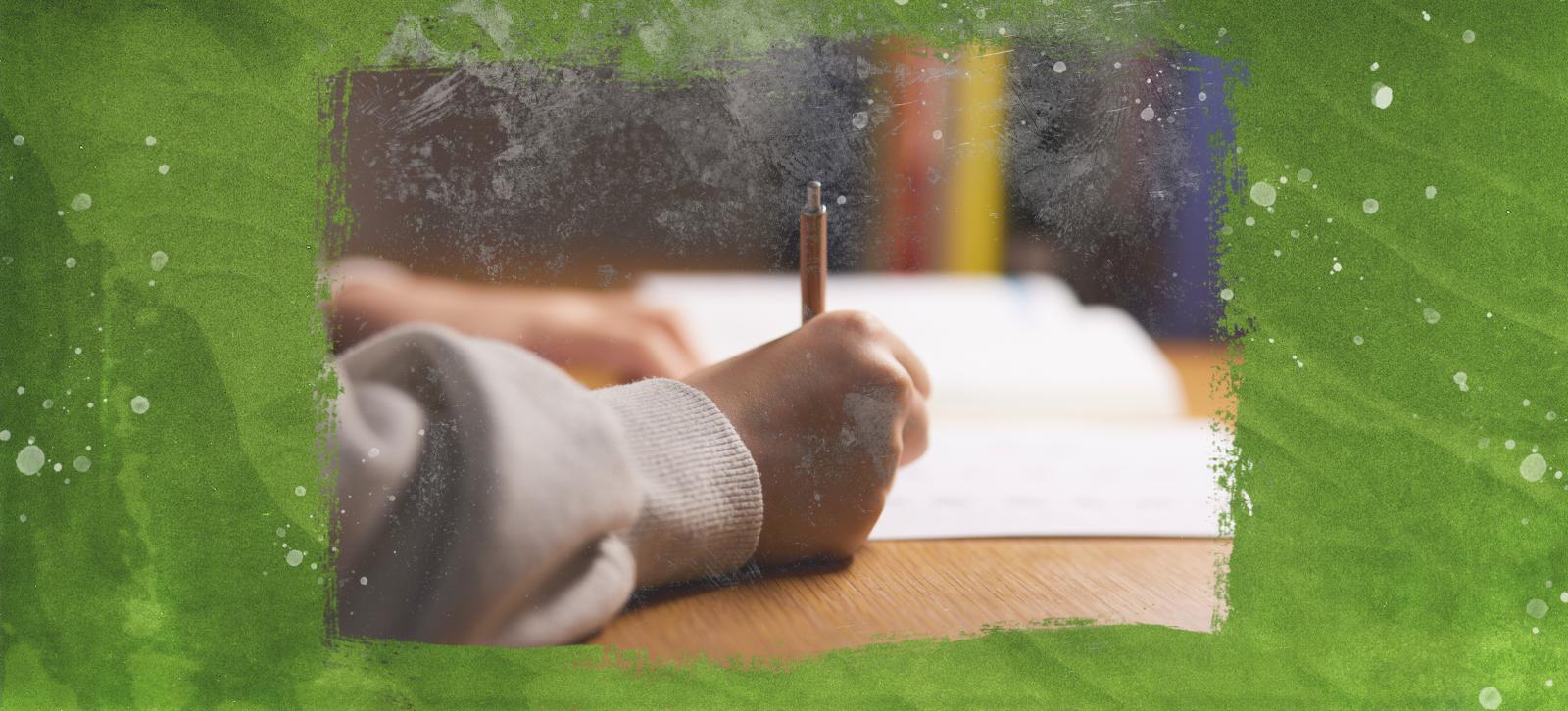 Person writing in a notebook.