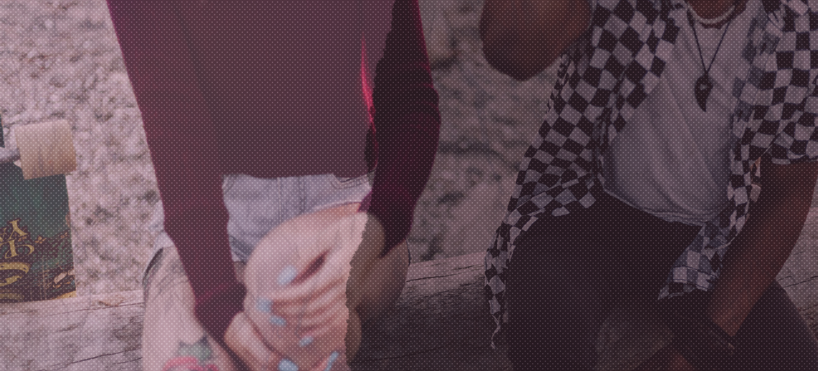 Image of two friends sitting down.