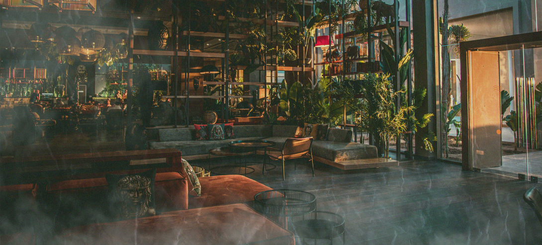 a lounge with couches covered in a cloud of smoke